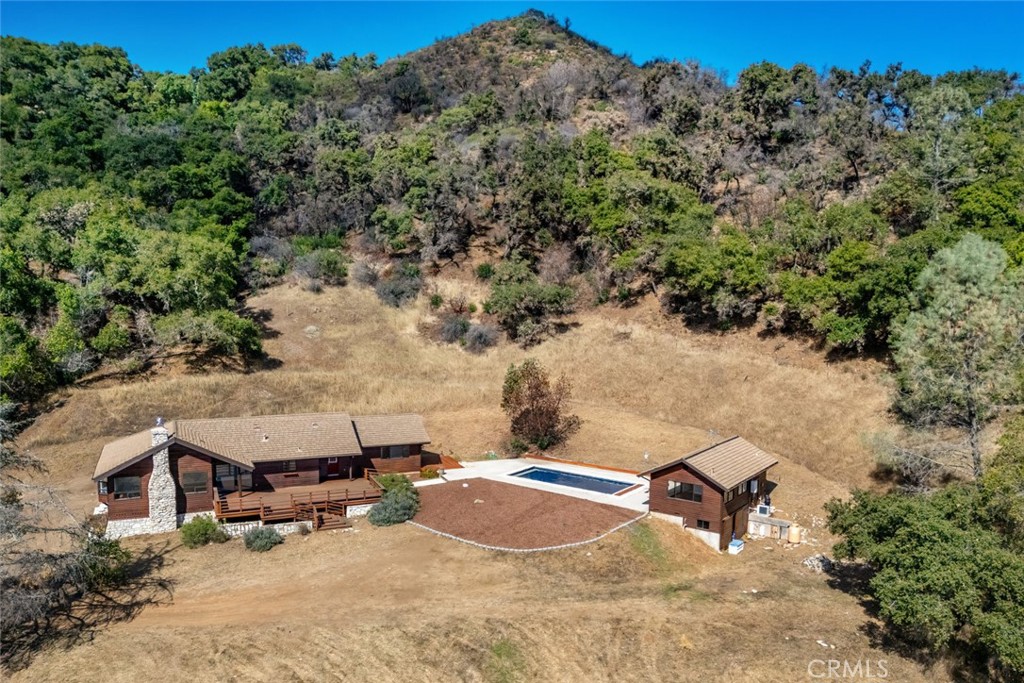 3265 Cypress Mountain Road Templeton, CA 93465 - Photo 29 of 32 an aerial view of a house with a yard and trees in the background