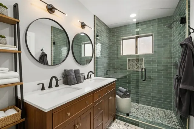 an aerial view of residential houses with outdoor space and trees