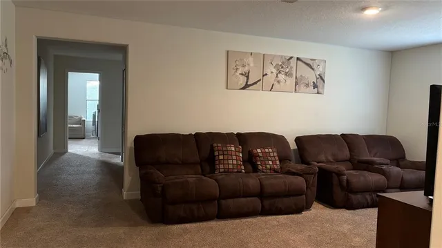 a living room with furniture and a couch