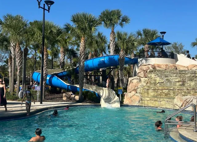 a view of a park with swings and slides