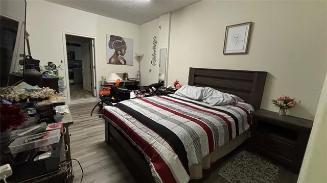 a bedroom with bed and a closet