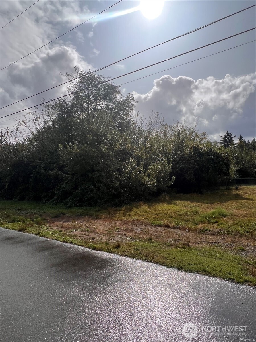 0 West Farrell Street Aberdeen, WA 98520 - Photo 1 of 1 a view of a yard with a wooden fence