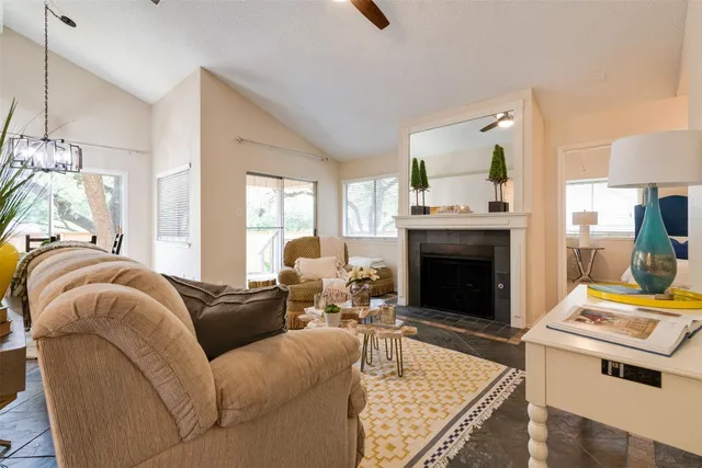 a living room with furniture and a fireplace