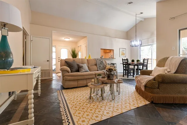 a living room with furniture and a rug