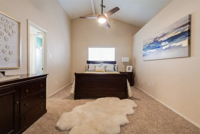 a bedroom with a bed and a dresser