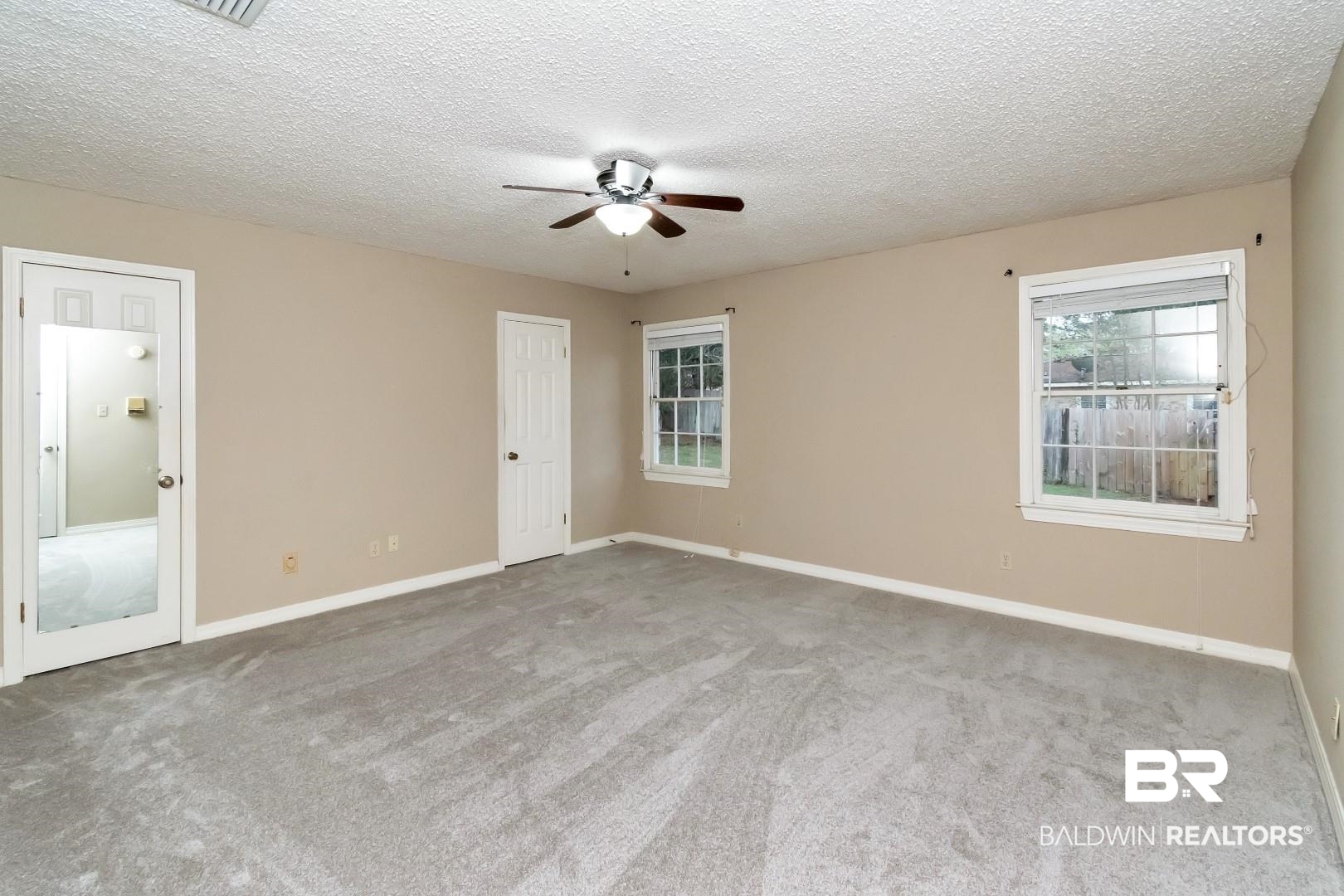 1229 West Chimney Top Drive Mobile, AL 36695 - Photo 19 of 36 Primary bedroom with separate his/her vanity areas. Each with it's own walk in closet. Tub/shower/toilet is in between. Great set up!
