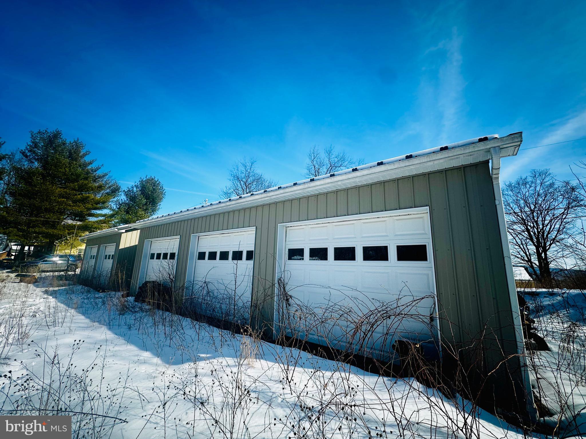 82 Kingbaum Street Ridgeley, WV 26753 - Photo 2 of 13 a front view of a house with a yard