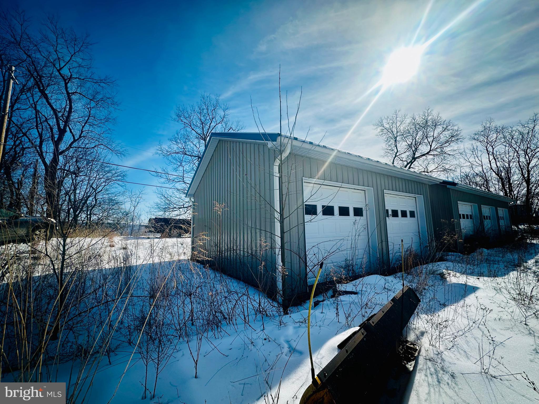 82 Kingbaum Street Ridgeley, WV 26753 - Photo 3 of 13 a view of backyard with a large tree and wooden fence