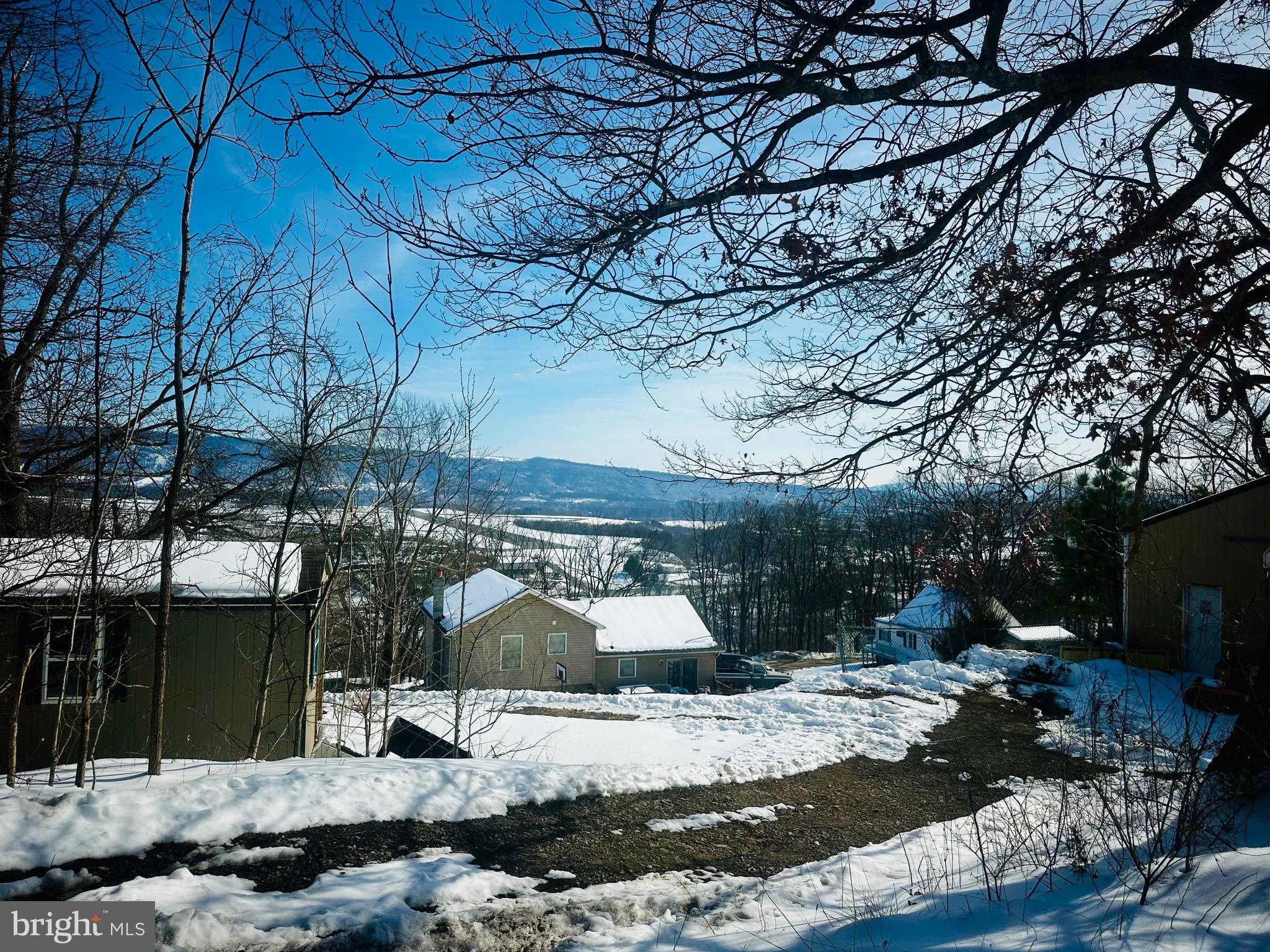 82 Kingbaum Street Ridgeley, WV 26753 - Photo 5 of 13 a wooden bench sitting in front of a house