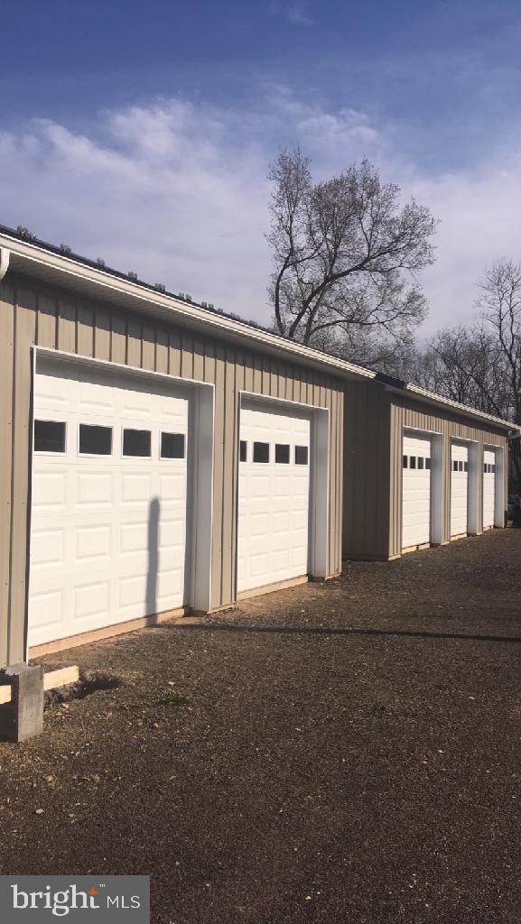 82 Kingbaum Street Ridgeley, WV 26753 - Photo 9 of 13 a front view of a house with a garage