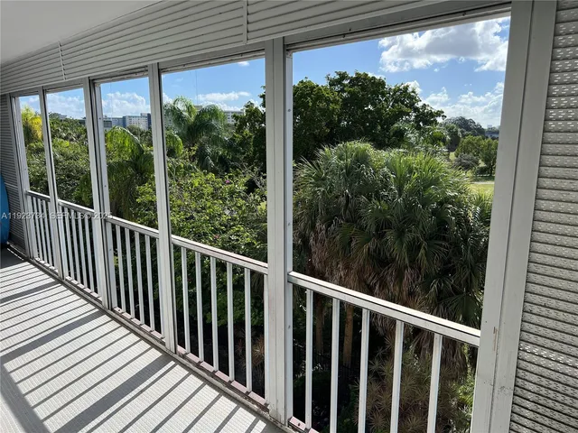 a view of a balcony with garden