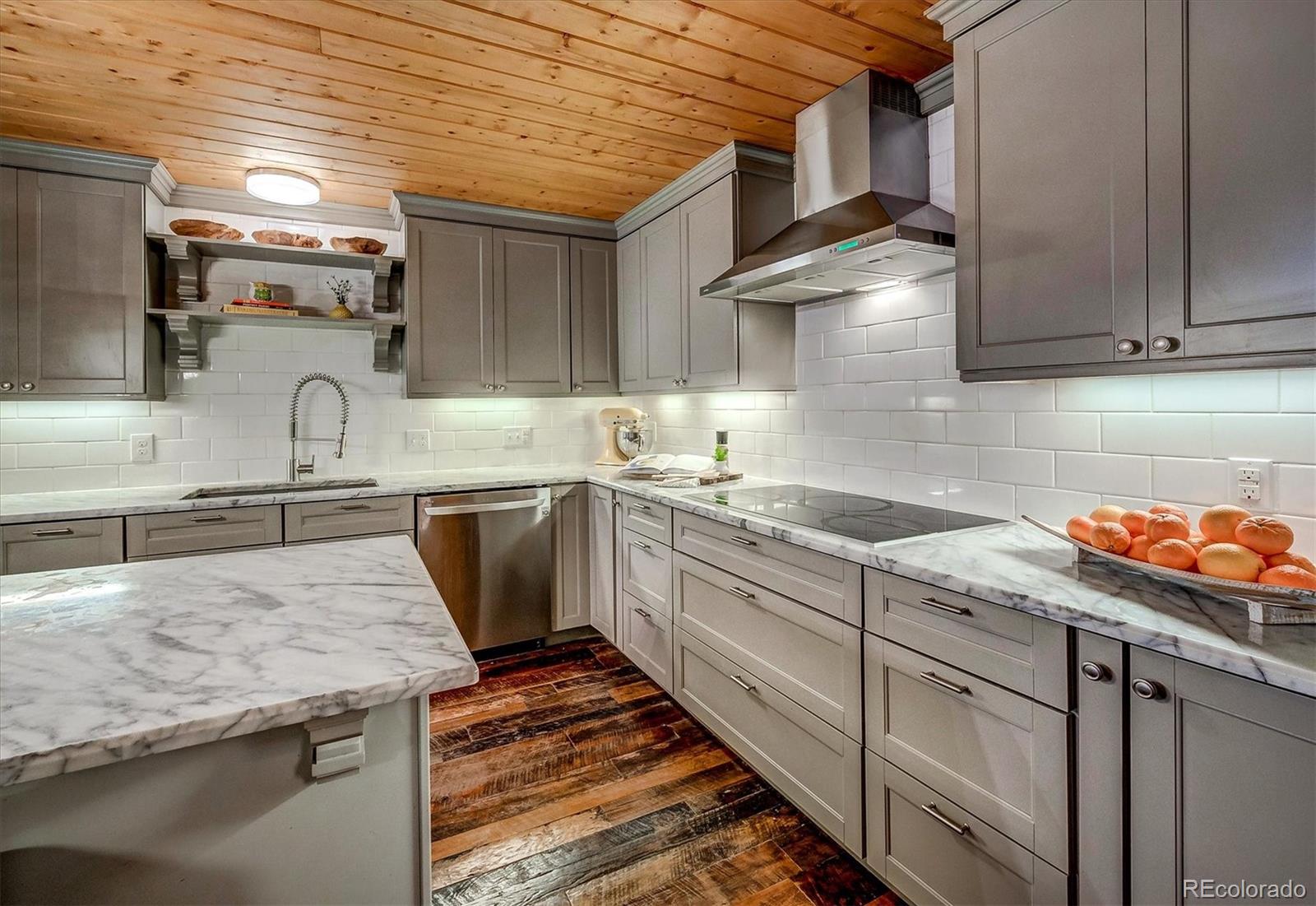 9055 Eagle Cliff Road Conifer, CO 80433 - Photo 11 of 39 a kitchen with stainless steel appliances granite countertop a sink stove and cabinets