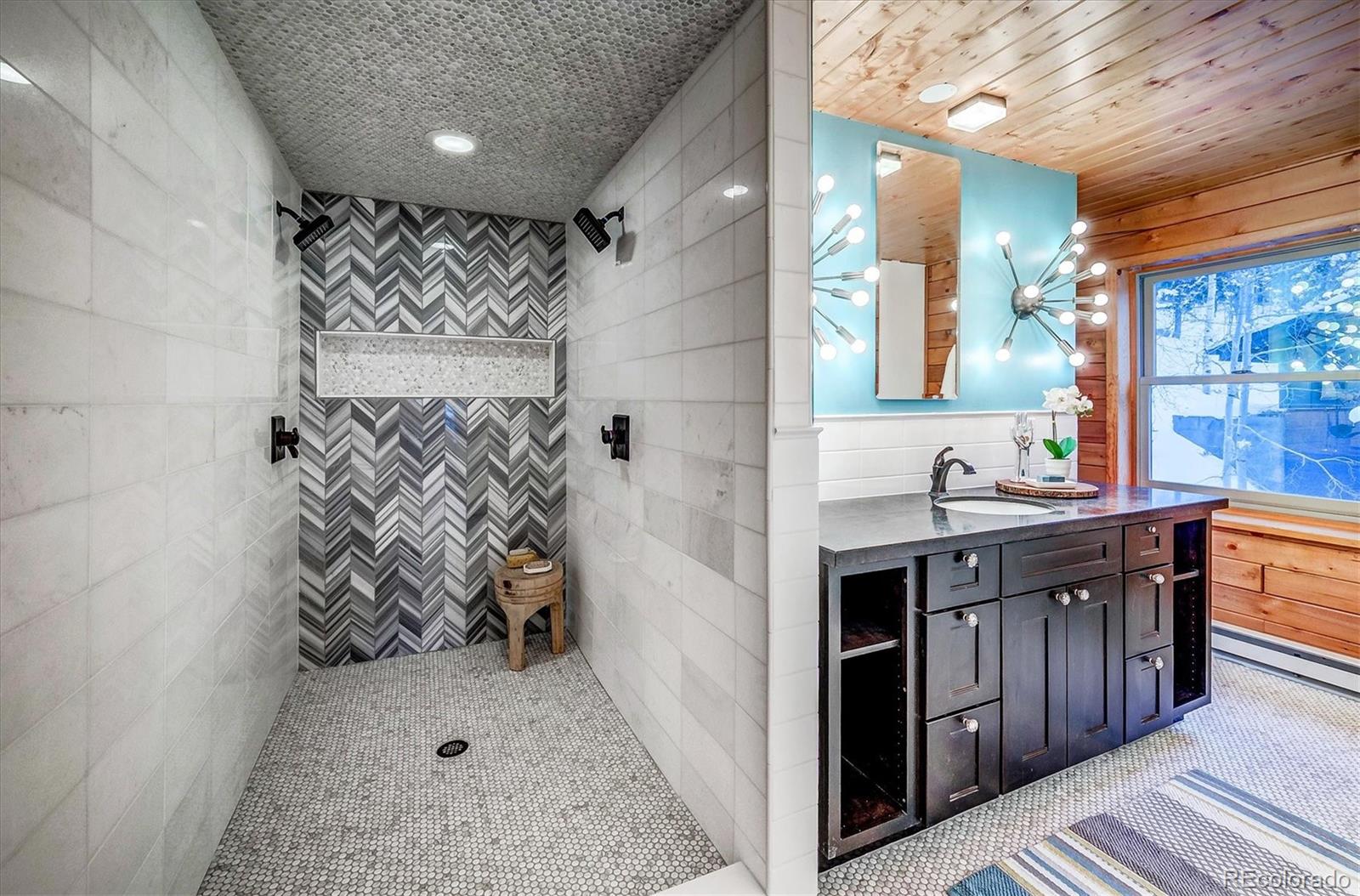 9055 Eagle Cliff Road Conifer, CO 80433 - Photo 18 of 39 a bathroom with a sink and a mirror