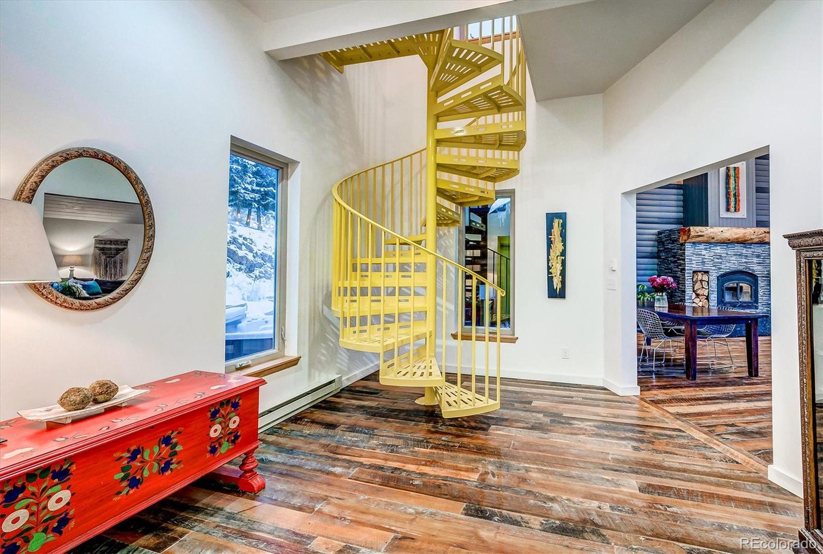 9055 Eagle Cliff Road Conifer, CO 80433 - Photo 25 of 39 a living room with furniture and a wooden floor