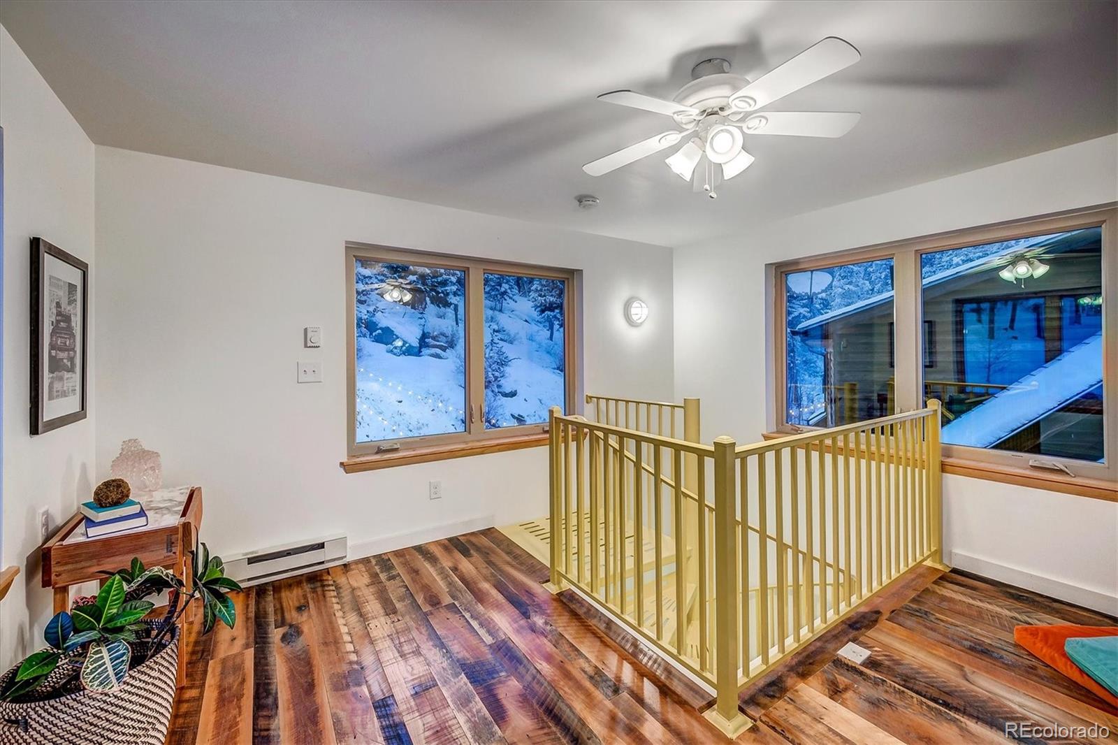 9055 Eagle Cliff Road Conifer, CO 80433 - Photo 26 of 39 a view of a hallway with workspace