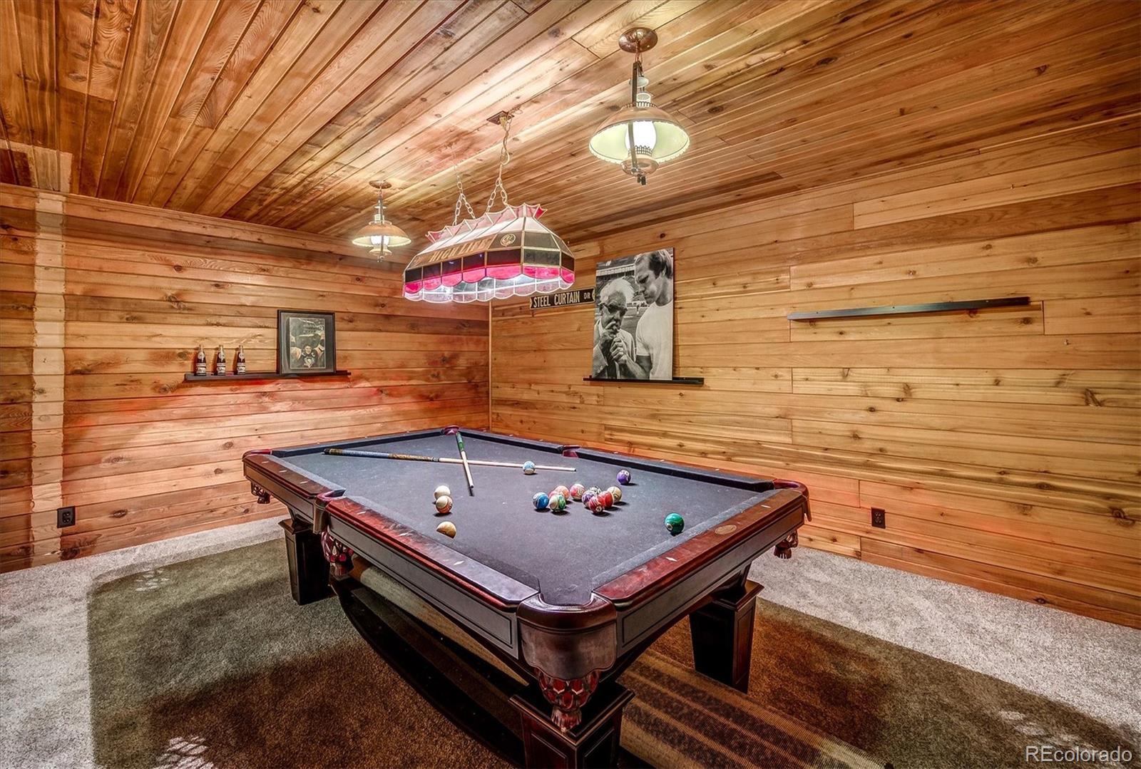9055 Eagle Cliff Road Conifer, CO 80433 - Photo 30 of 39 a view of a two chairs in the balcony