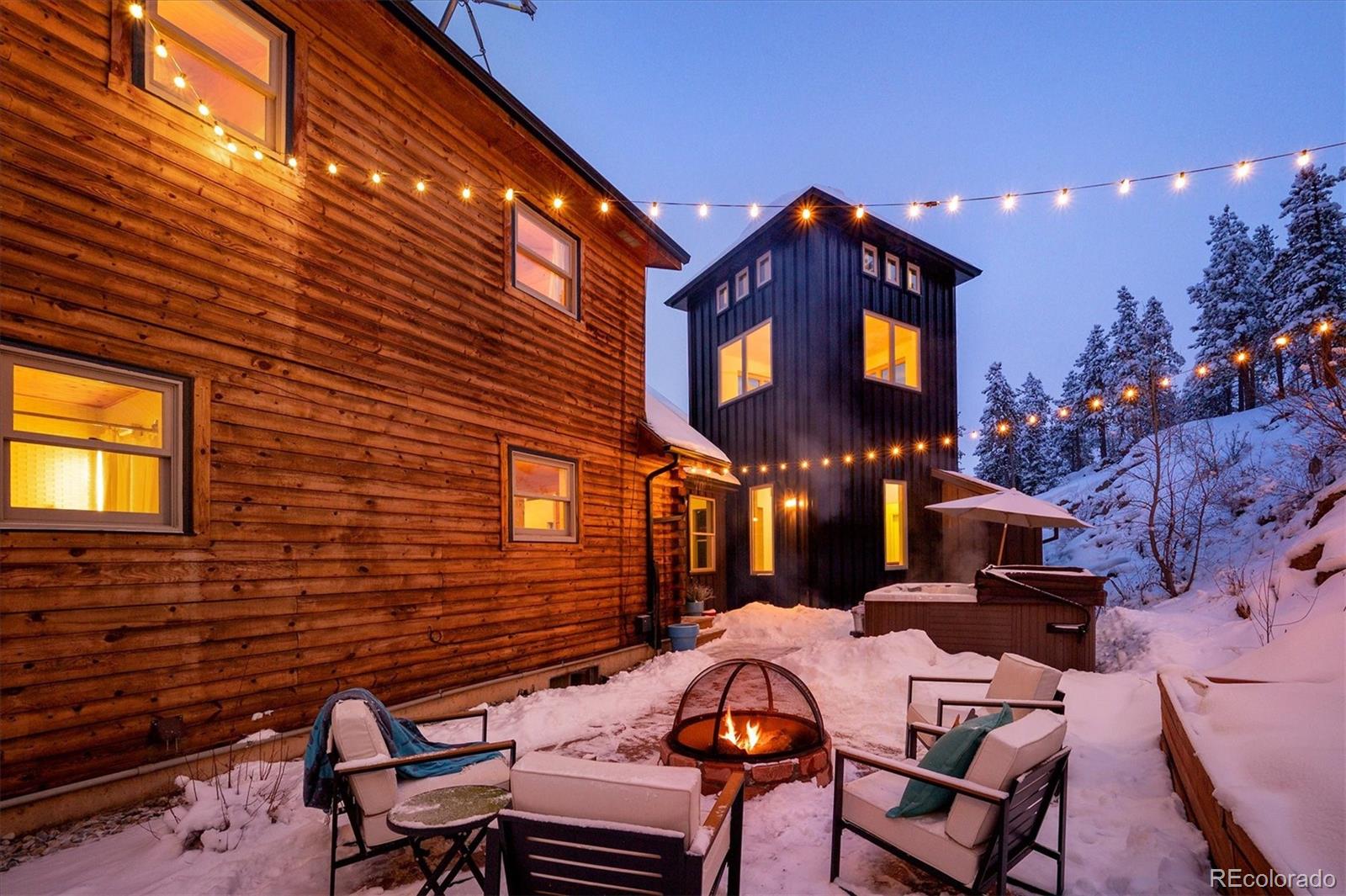 9055 Eagle Cliff Road Conifer, CO 80433 - Photo 32 of 39 a front view of a house with a yard