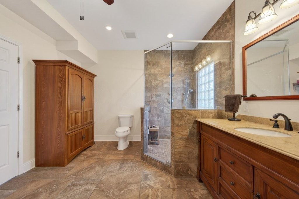 6610 Sprigg Street Fulshear, TX 77441 - Photo 26 of 49 a spacious bathroom with a sink a toilet and a shower