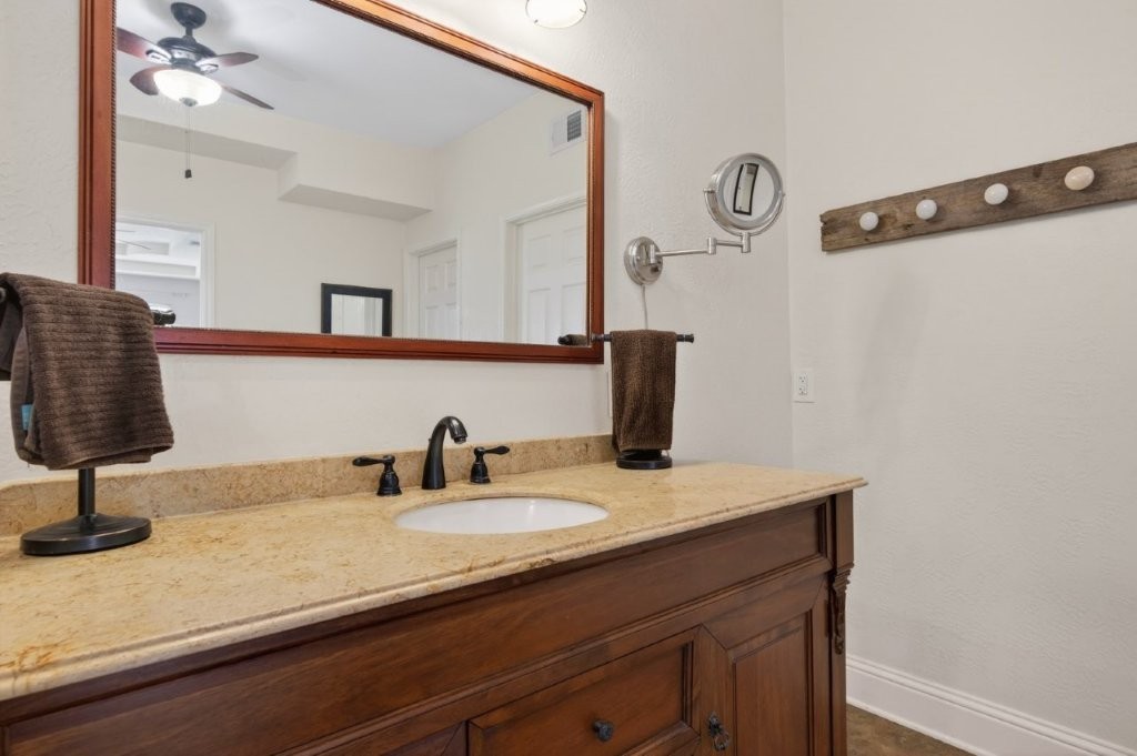 6610 Sprigg Street Fulshear, TX 77441 - Photo 27 of 49 a bathroom with a sink vanity and a mirror