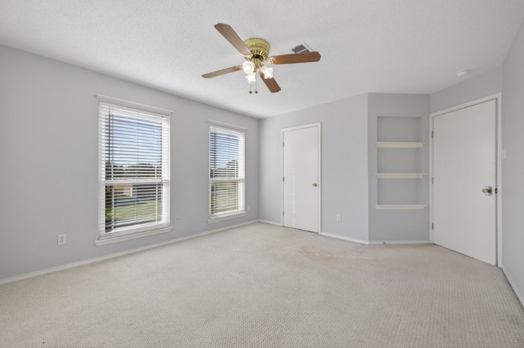 6610 Sprigg Street Fulshear, TX 77441 - Photo 30 of 49 a view of an empty room with a window