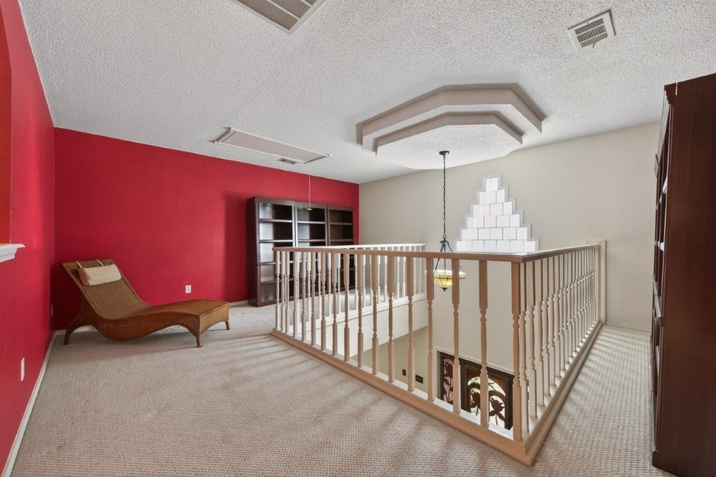 6610 Sprigg Street Fulshear, TX 77441 - Photo 32 of 49 a view of staircase with railing and white walls