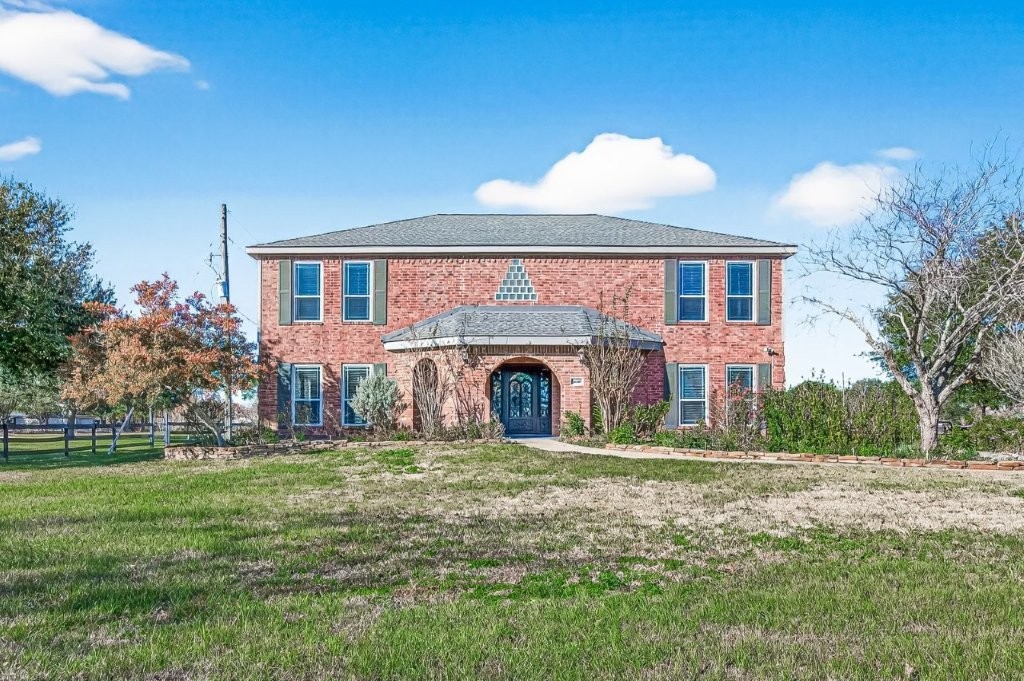 6610 Sprigg Street Fulshear, TX 77441 - Photo 5 of 49 a view of front a house with a yard
