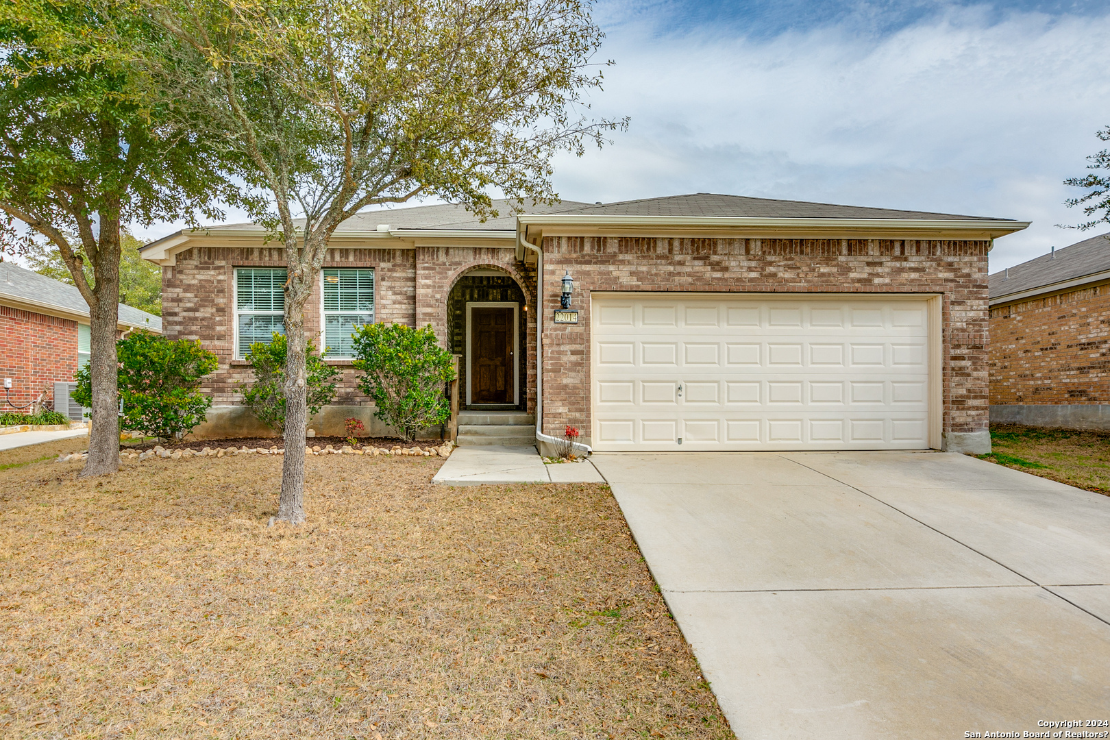 22014 Ruby Run San Antonio, TX 78259 - Photo 1 of 1 a front view of a house with a yard and garage