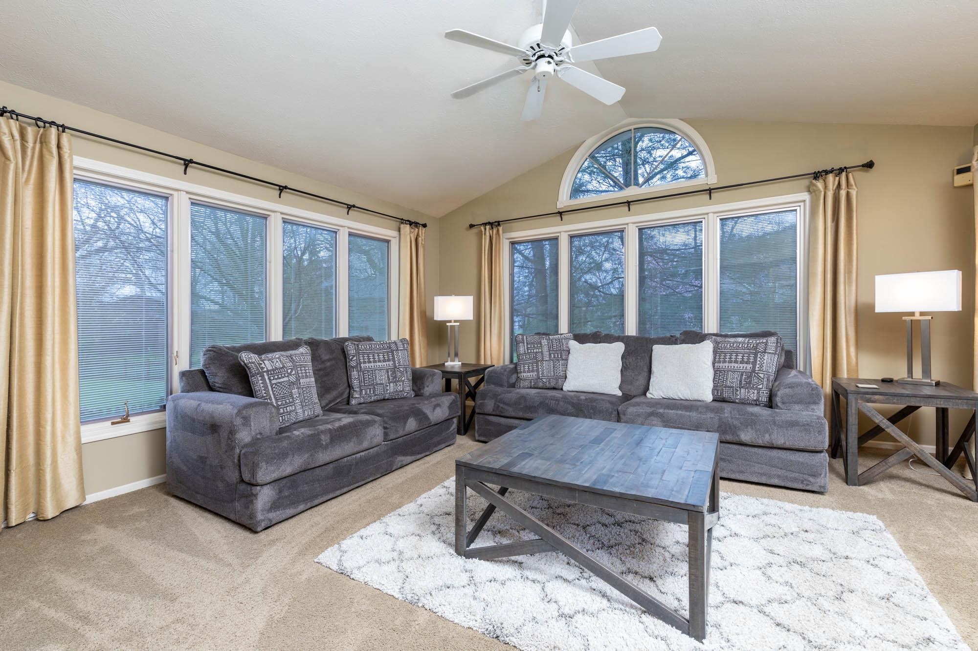 7113 Sentinel Road Rockford, IL 61107 - Photo 17 of 38 a living room with furniture a table and a large window