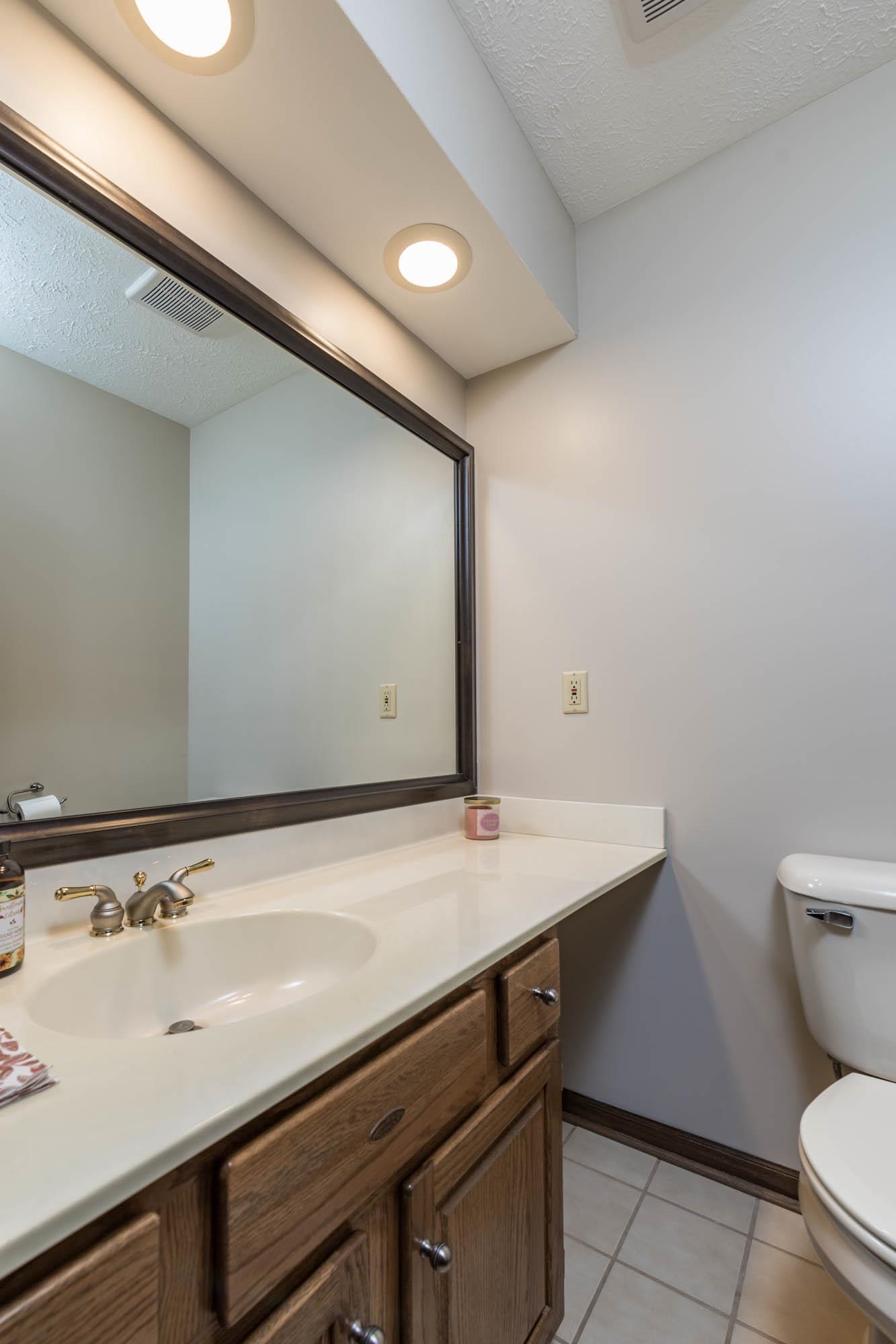 7113 Sentinel Road Rockford, IL 61107 - Photo 18 of 38 a bathroom with a sink and a toilet