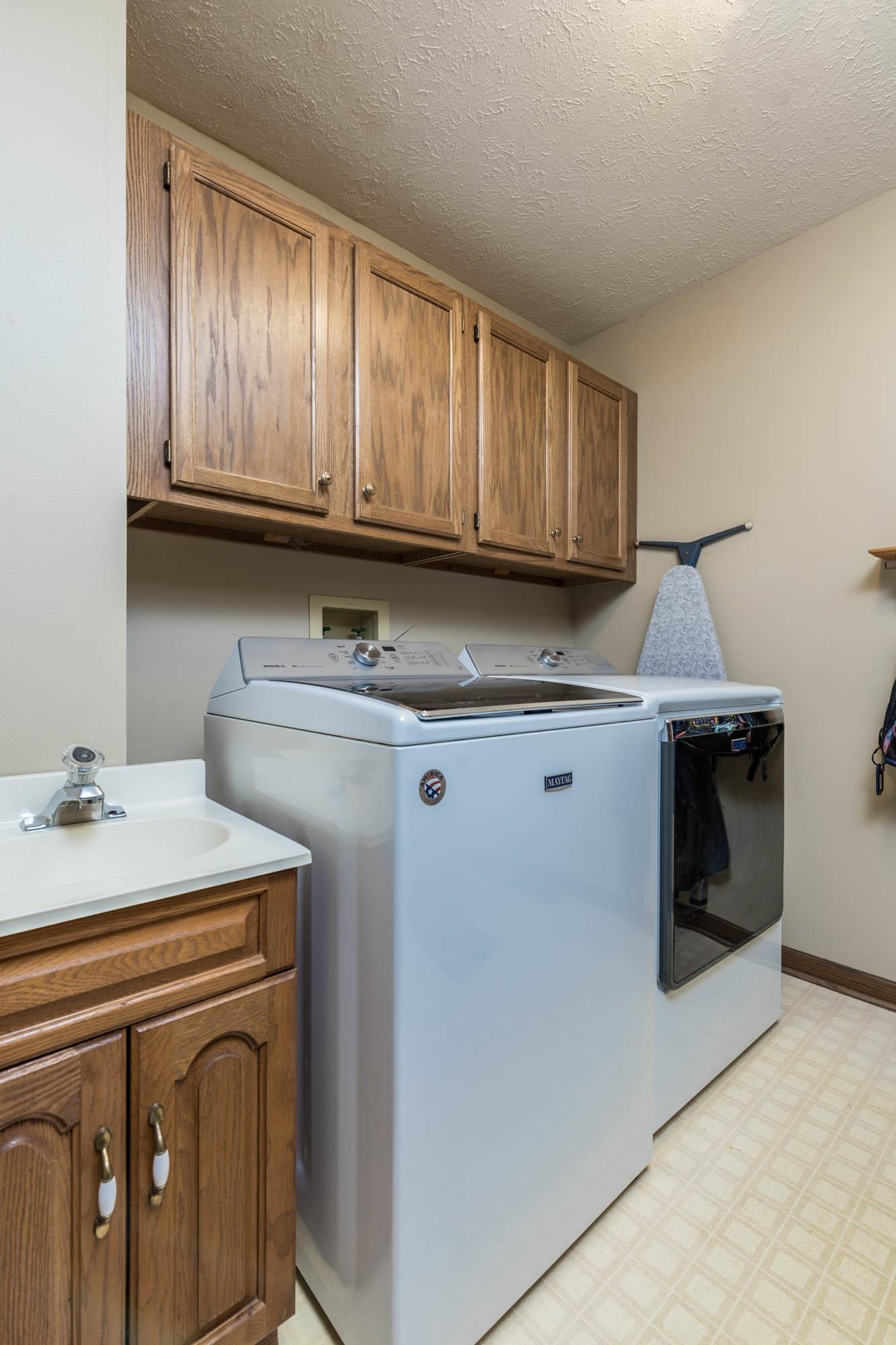 7113 Sentinel Road Rockford, IL 61107 - Photo 19 of 38 a kitchen with stainless steel appliances granite countertop a sink stove and cabinets