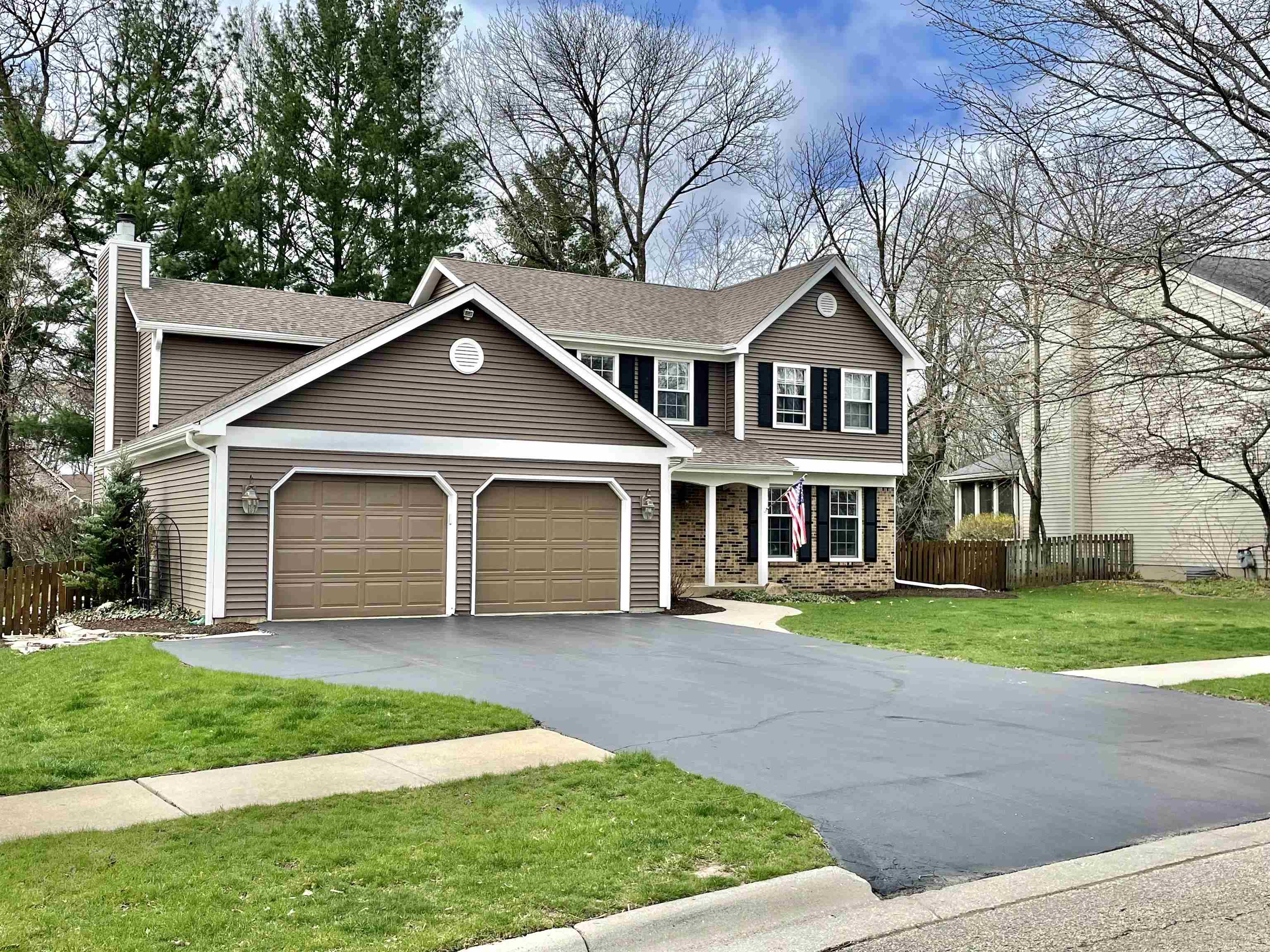 7113 Sentinel Road Rockford, IL 61107 - Photo 2 of 38 a front view of a house with a yard and garage
