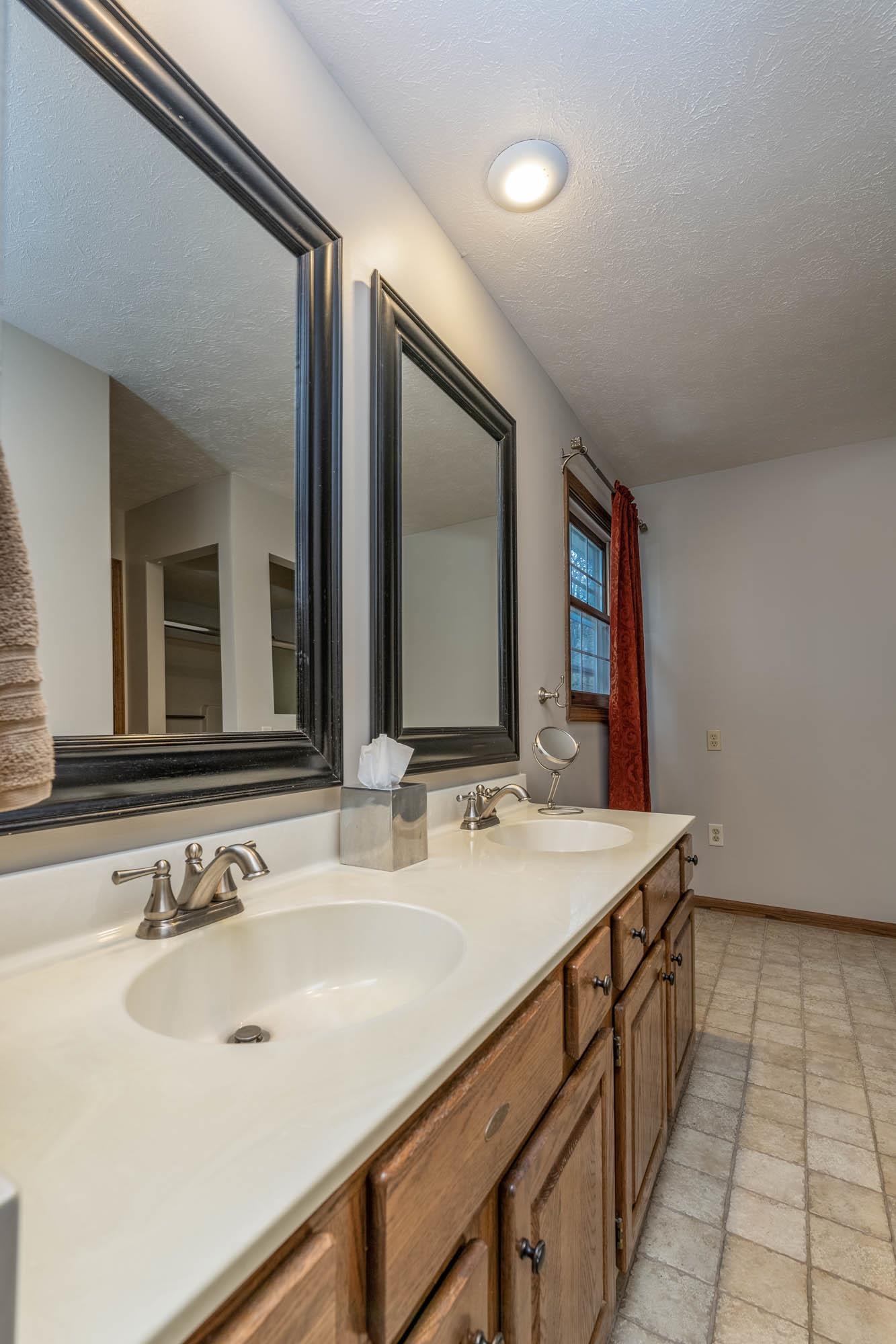 7113 Sentinel Road Rockford, IL 61107 - Photo 22 of 38 a bathroom with a sink and a mirror