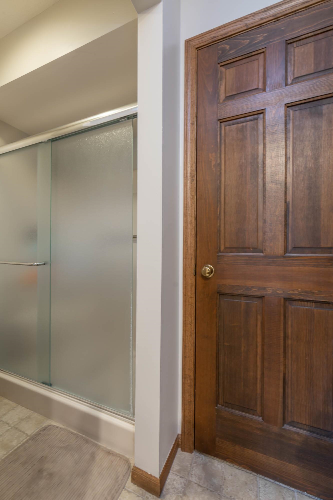 7113 Sentinel Road Rockford, IL 61107 - Photo 23 of 38 a bathroom with a glass door shower