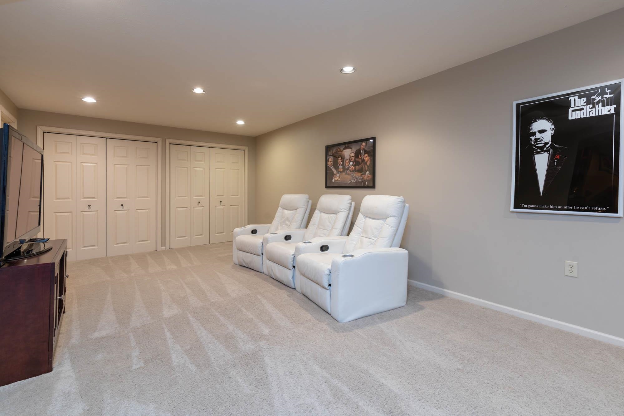 7113 Sentinel Road Rockford, IL 61107 - Photo 29 of 38 a spacious bedroom with a bed and a television