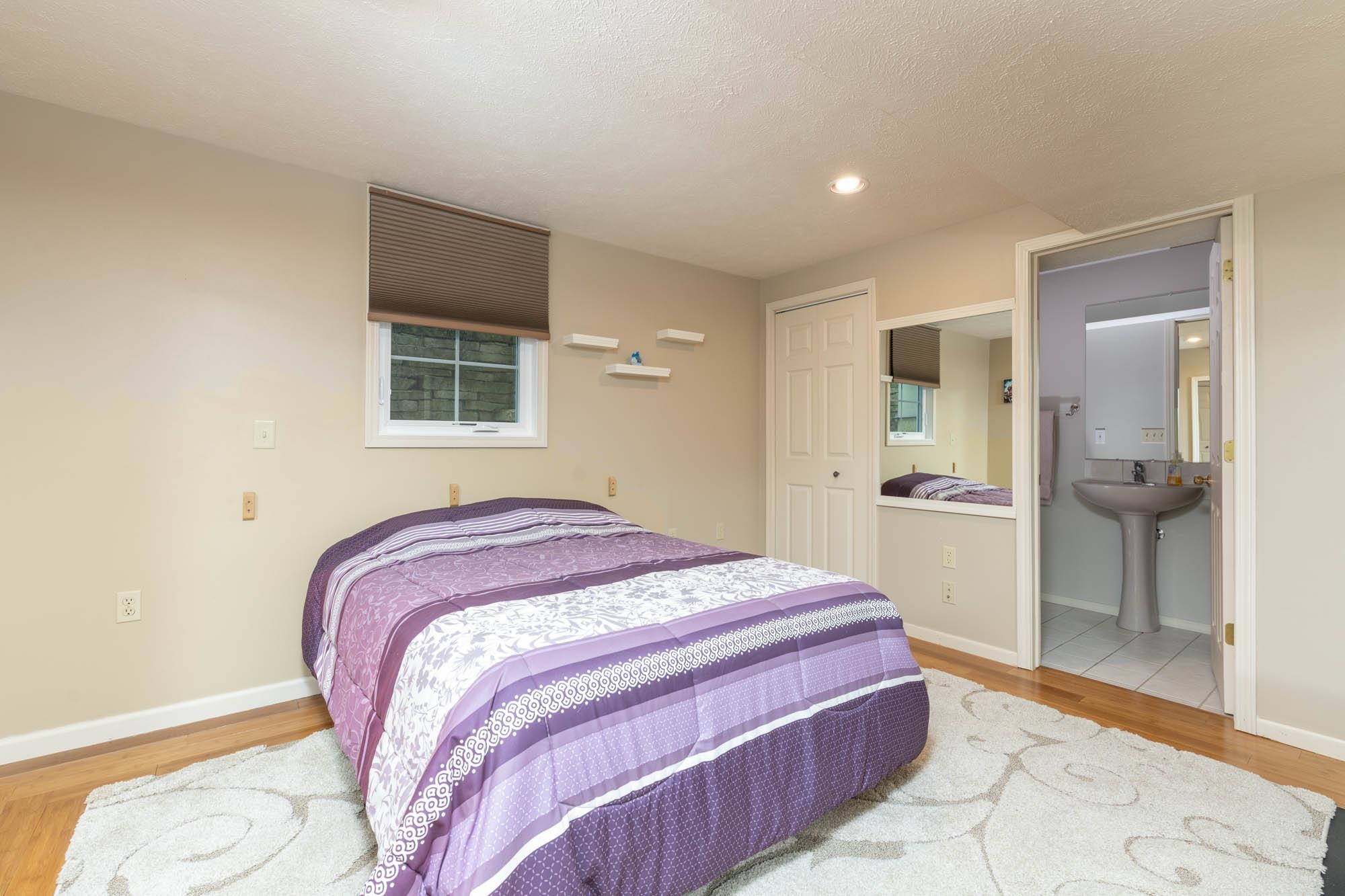 7113 Sentinel Road Rockford, IL 61107 - Photo 32 of 38 a bedroom with a bed and a mirror