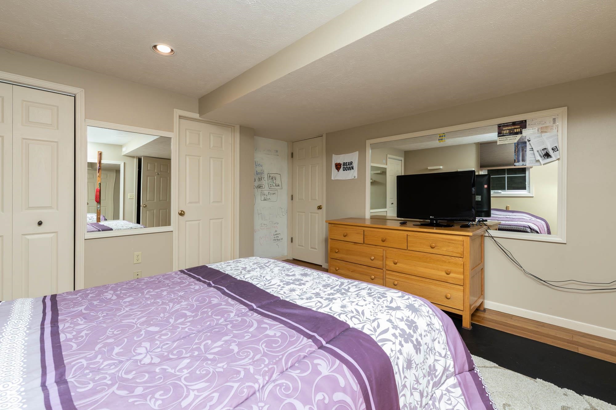 7113 Sentinel Road Rockford, IL 61107 - Photo 33 of 38 a bedroom with a bed and a flat screen tv