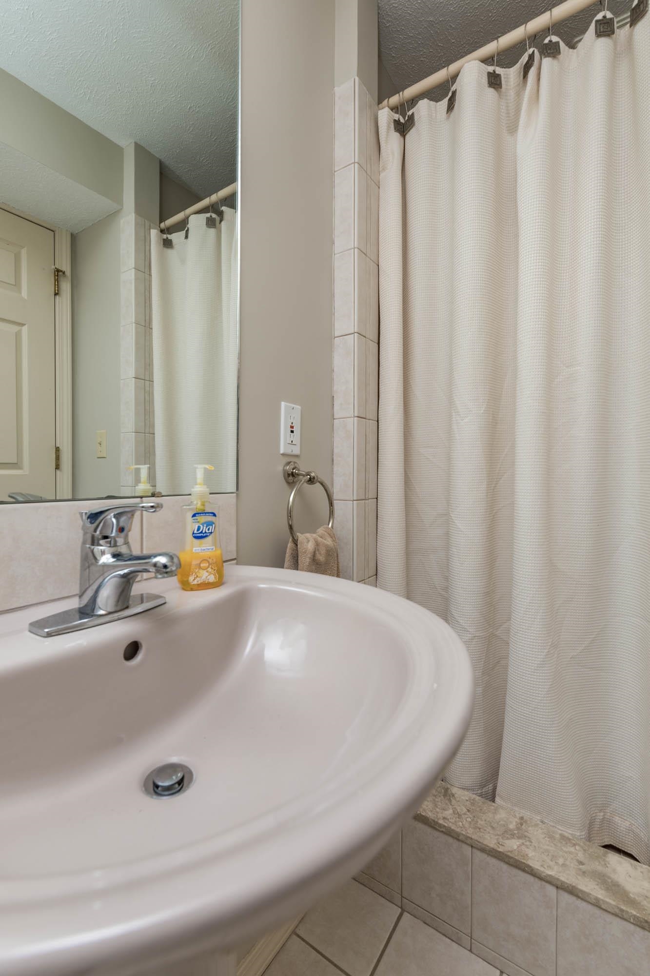 7113 Sentinel Road Rockford, IL 61107 - Photo 34 of 38 a bathroom with a sink and a mirror