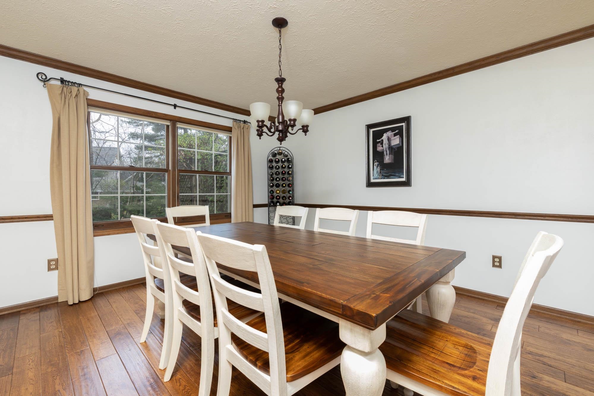 7113 Sentinel Road Rockford, IL 61107 - Photo 7 of 38 a view of a dining room with furniture window and wooden floor