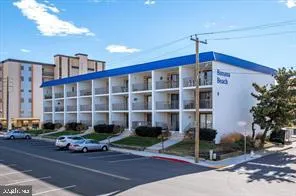 a front view of a building with street view and glass windows