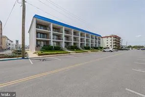 a front view of building with street