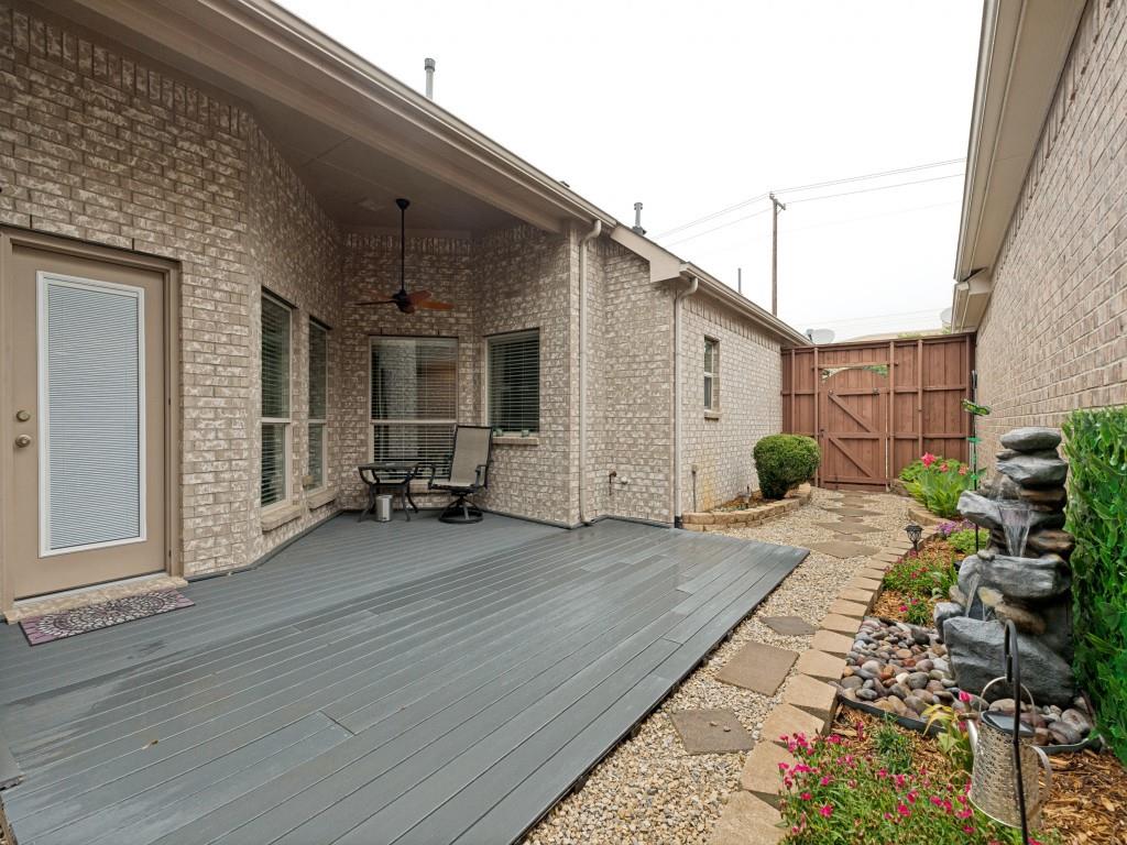 10032 Bell Rock Road Frisco, TX 75035 - Photo 17 of 23 Covered patio featuring a composite deck, plumbed for gas grill, and ceiling fan.