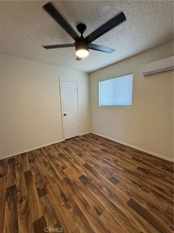 en empty room with wooden floor