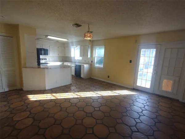 a view of a kitchen and utility room
