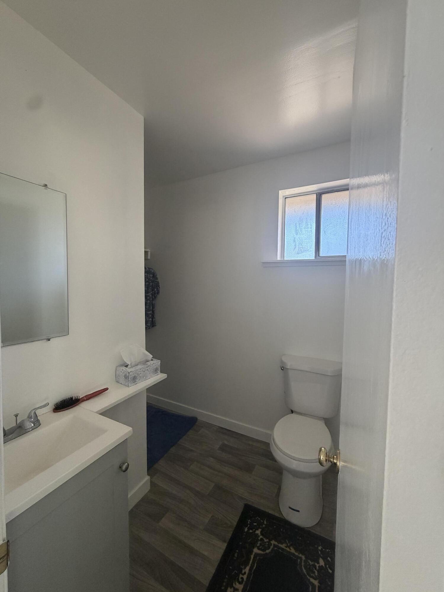 56758 Whitmore Street Bly, OR 97622 - Photo 10 of 12 a bathroom with a toilet a sink and mirror