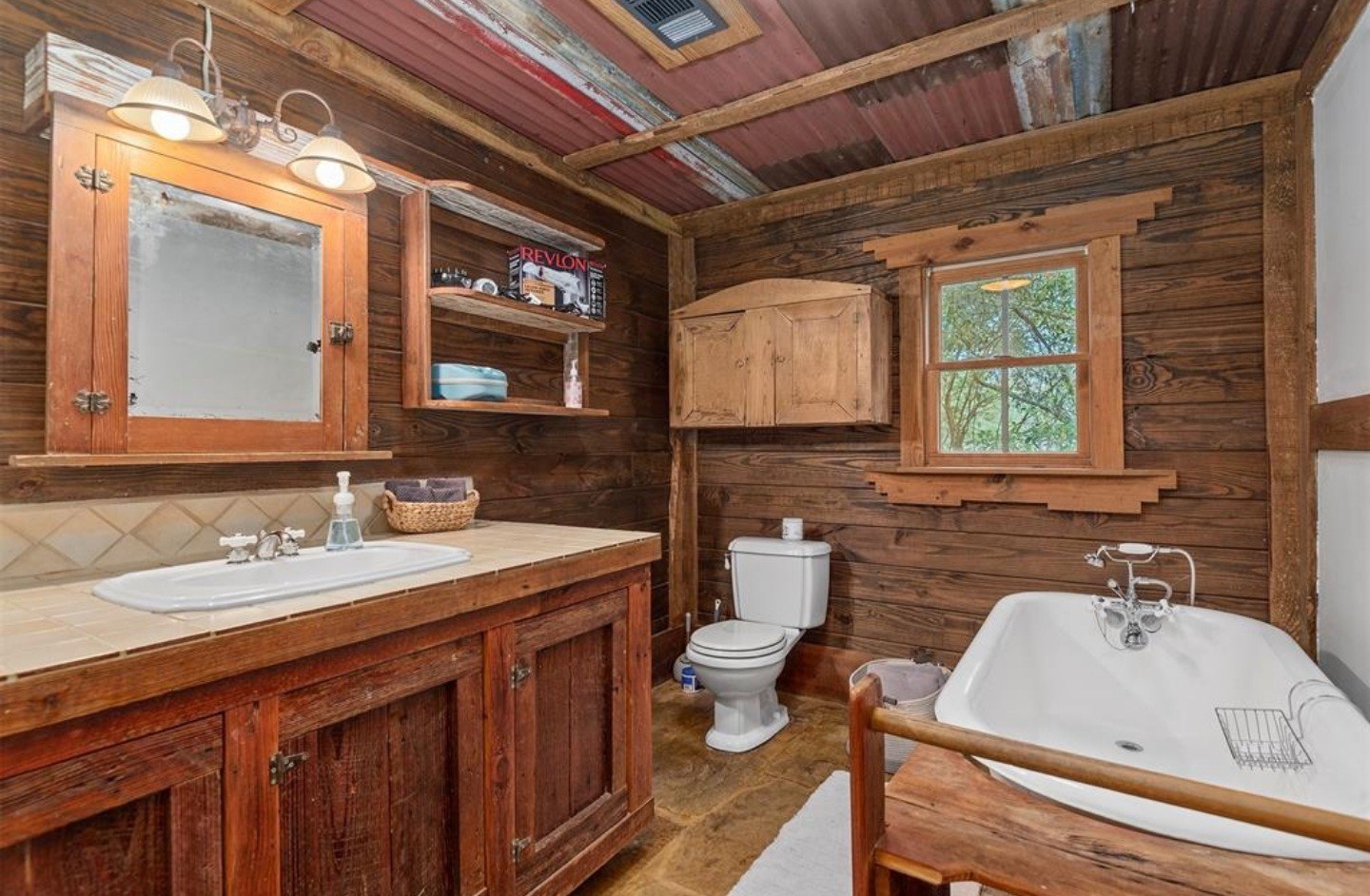 23207 Decker Prairie-Rosehill Road Magnolia, TX 77355 - Photo 12 of 29 a bathroom with a sink and a mirror