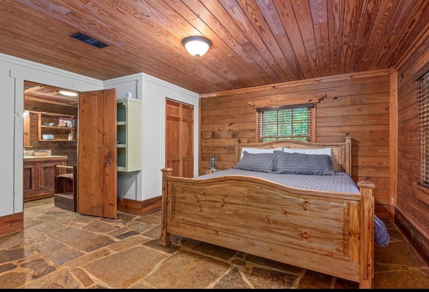 23207 Decker Prairie-Rosehill Road Magnolia, TX 77355 - Photo 17 of 29 a bed sitting in a spacious bedroom next to a window