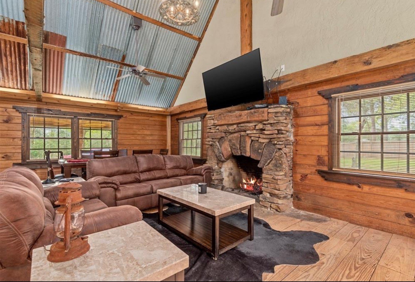 23207 Decker Prairie-Rosehill Road Magnolia, TX 77355 - Photo 23 of 29 a living room with fireplace furniture and a flat screen tv