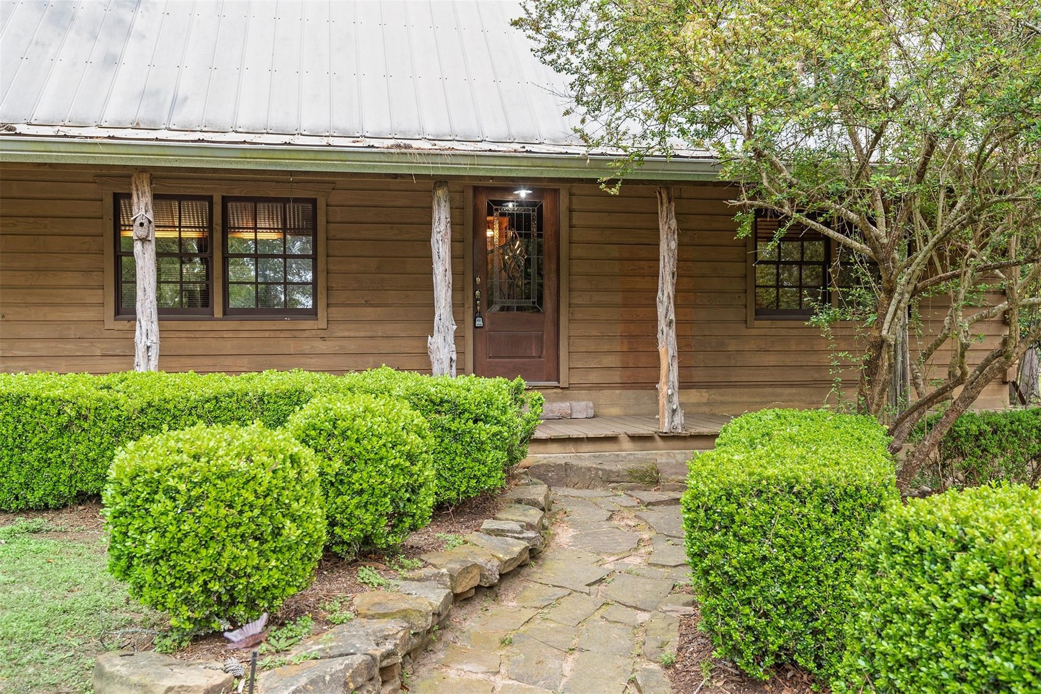23207 Decker Prairie-Rosehill Road Magnolia, TX 77355 - Photo 29 of 29 a front view of a house with garden