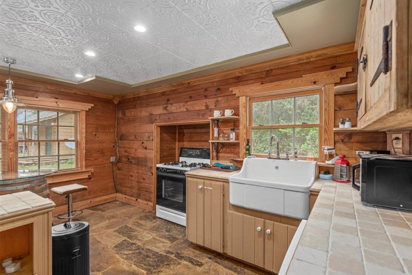 23207 Decker Prairie-Rosehill Road Magnolia, TX 77355 - Photo 8 of 29 a kitchen with a stove and a microwave