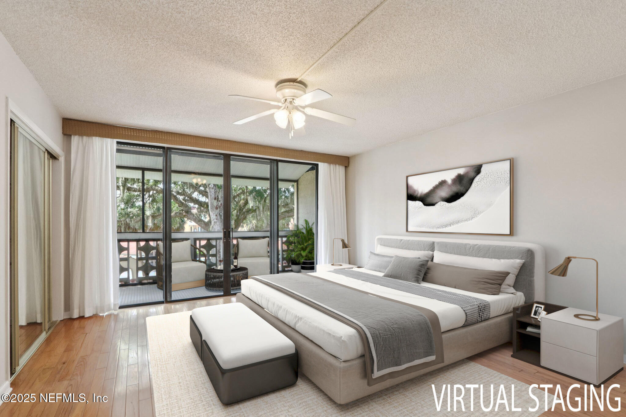 1810 Sevilla Boulevard West, Unit 307 Atlantic Beach, FL 32233 - Photo 15 of 28 a bedroom with a large bed and a large window